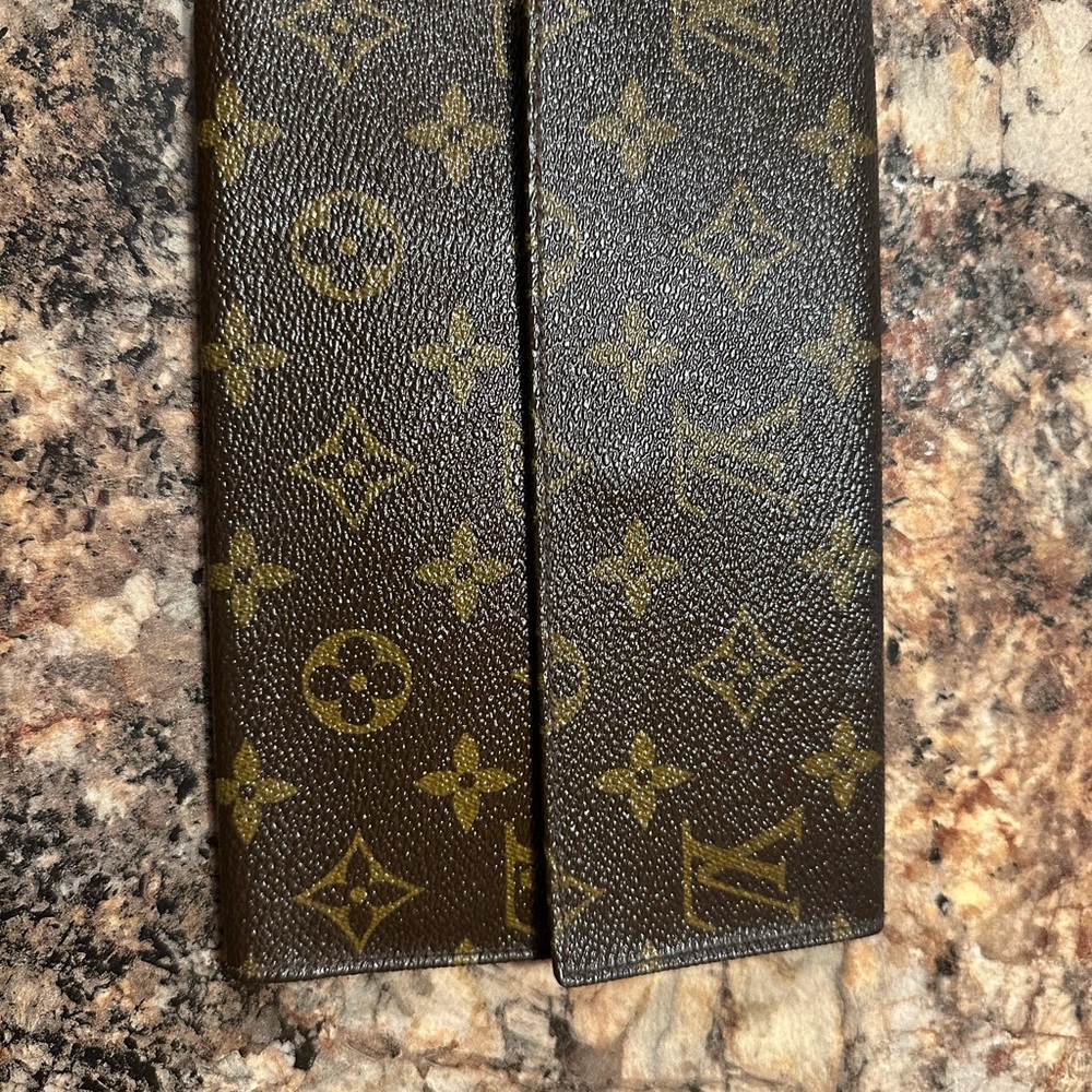 Louis Vuitton Brown Monogram Wallet folding with a snap closure